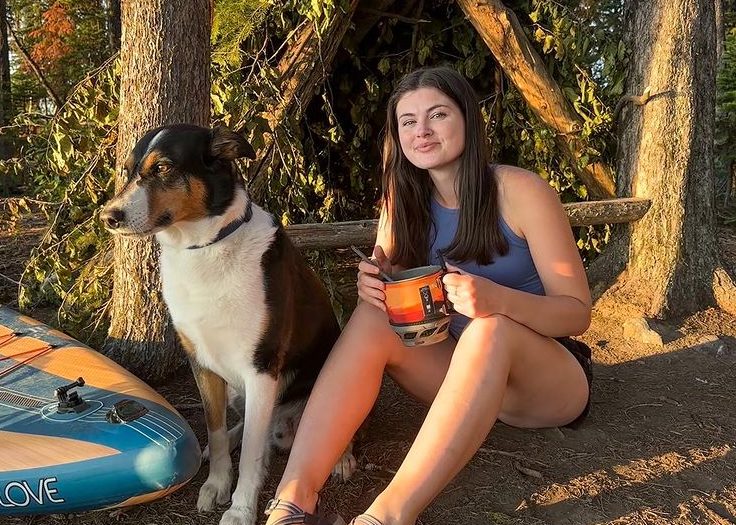 Madison Clysdale on outdoor trip with dog